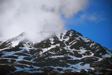 Sunlight highlighting the snowy mountain peaks in Alaska 