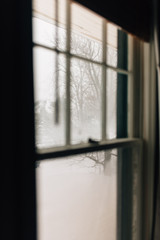 View of a snowstorm from inside of a home