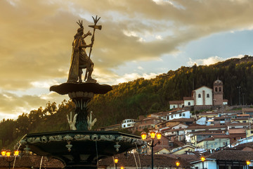 View of the fountain with San Cristobal church in the background. Plaza de Armas, Cusco, Peru