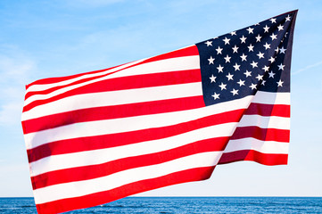 Fototapeta premium American flag on blue sky. USA Independence day, 4th July. United States flag