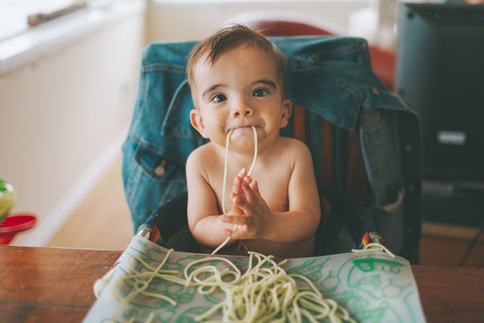 A Baby Eating Spaghetti.