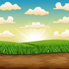 Obraz premium The sun rising or setting over a beautiful green field of grass