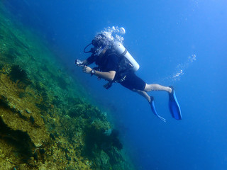 A scuba diver enjoy a leisure dive in Tunku Abdul Rahman Park, Kota Kinabalu. Sabah, Malaysia. Borneo.  