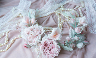 Wedding background with pearls and hair accessories on pink background