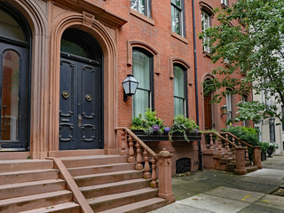Fototapeta na wymiar stone front step of elegant old urban brownstone type townhouse with double door