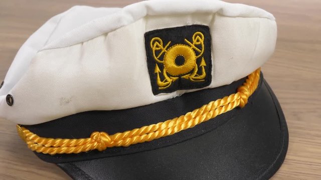 Sailor mariner hat closeup. Camera turning around the subject.