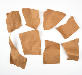 torn brown pieces of parchment paper