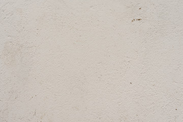 Fototapeta premium Texture of a concrete wall with cracks and scratches which can be used as a background