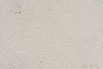 Texture of a concrete wall with cracks and scratches which can be used as a background