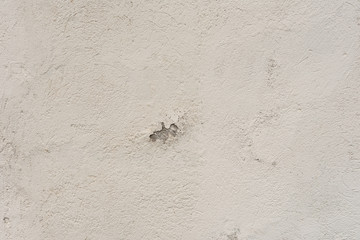 Texture of a concrete wall with cracks and scratches which can be used as a background