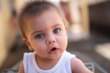 Blue-eyed baby looking with serene face