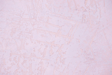 Wall fragment with scratches and cracks.ight pink plaster Wall Texture. Pastel Background. Abstract Painted Wall Surface. Stucco Background With Copy Space For design.concrete wall surface texture