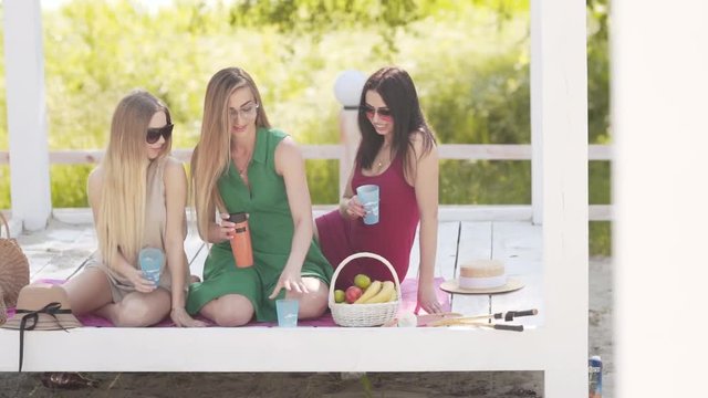 Independent polish women having a picnic outdoors, medium shot