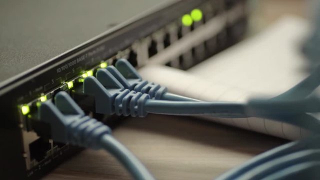Network engineer working on Ethernet cable switch