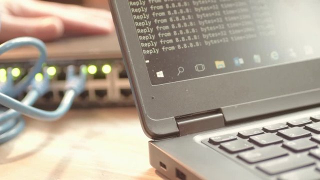 Network engineer working on Ethernet cable switch