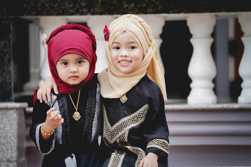 Muslim children smiling with happiness. Family and relationship of children concept.
