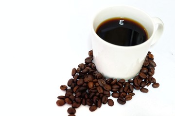 Coffee cup and beans on a white background.