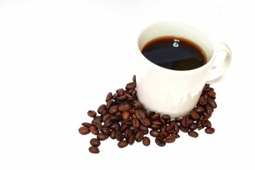 Coffee cup and beans on a white background.