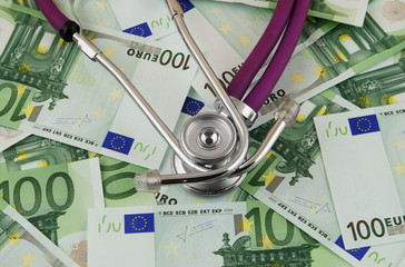 Stethoscope on euro banknotes, cost of healthcare concept