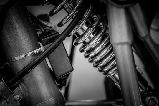Black and white image of vintage motorbike closeup
