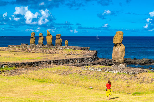 Young woman prepared to take picture of Moai at Ahu Vai Uri