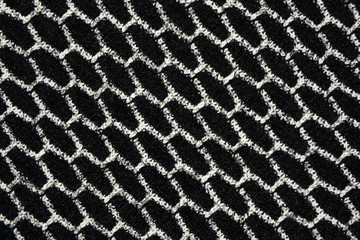 The texture of the knitted gray fabric for the background  
