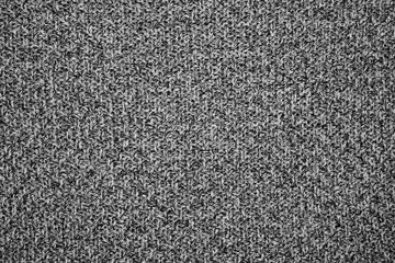 The texture of the knitted gray fabric for the background  