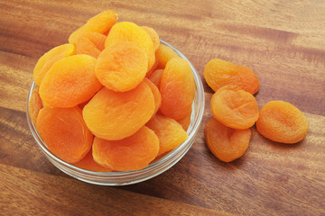 Dried apricots fruits on wooden background