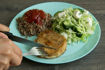 Medallion of pork, cabbage salad, pickle cheese and cucumbers, buckwheat with red sauce