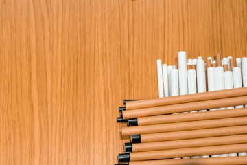 Bundle of paper straws white, brown and black in a wood table display background, great for environmental purpose
