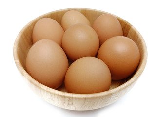 Raw fresh brown chicken eggs isolated on white background.