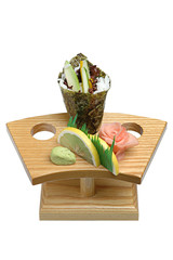 Mix of vegetables and seafood on a wooden stand, wasabi and pickled ginger. On white isolated background