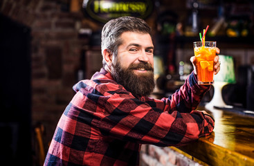 Cheerful bearded man, drink cocktails and smile. Tropical alcoholic fresh cocktail. Bearded man...