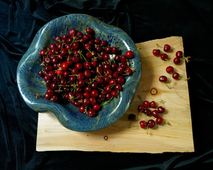 Fresh cherries in ceramic bowl