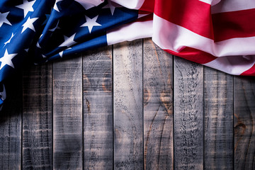 Top view of Flag of the United States of America on wooden background.  Independence Day USA,...