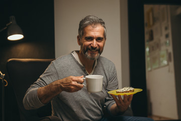 man having dinner in his home