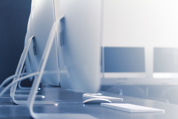 computers and keyboards in a workspace classroom