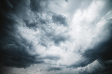 Dramatic cloudscape texture. Dark heavy thunderstorm clouds before rain. Overcast rainy bad weather. Storm warning. Natural gray background of cumulonimbus. Nature backdrop of stormy cloudy sky.