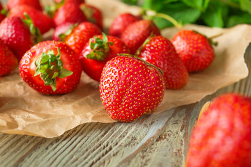 Sweet ripe strawberry on table, closeup