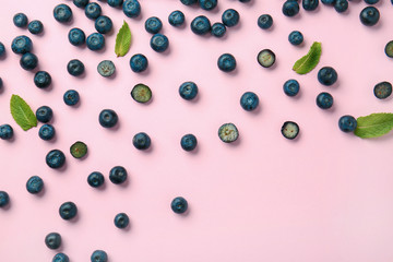 Many ripe blueberry on color background