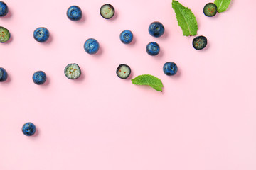 Many ripe blueberry on color background