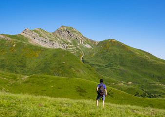 Man doing sports, mountaineer in front of Mount Orhy in the Pyrenees mountain range, France