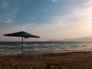 Umbrella on the sandy beach of Mediterranean Sea