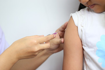 Close-up of doctor making vaccination to the patient on white background,Healthy concept