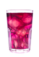 Glass of red grape juice with fruit isolated on white