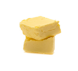 Pieces of butter isolated on white background