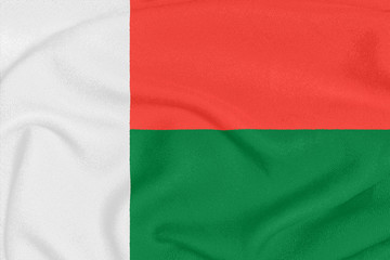 Flag of Madagascar on textured fabric. Patriotic symbol