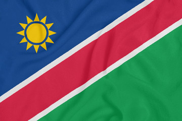 Flag of Namibia on textured fabric. Patriotic symbol