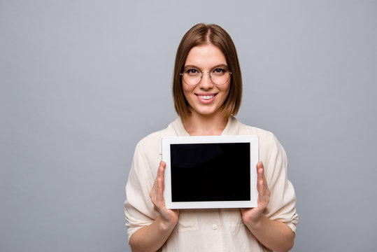 Close up photo beautiful cheer she her business lady hold e-reader hands arms presenting new model recommend cool quality low price wear specs casual jeans denim white shirt isolated grey background