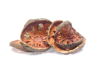 Dry bael fruit on white background
